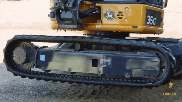 demonstration of testing track tension on a John Deere 35G mini excavator