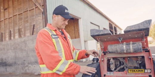 Heavy duty mechanic demonstrates replacing a hydraulic cap on DW SK755