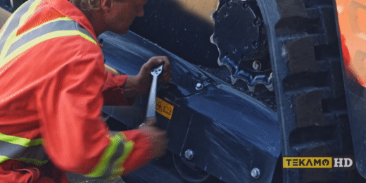 HD mechanic demonstrates how to remove the grease valve on a skid steer