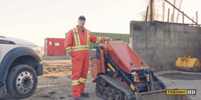 Ditch Witch mini skid steer being started up by a heavy equipment mechanic