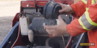 How install air filter housing on a mini skid steer