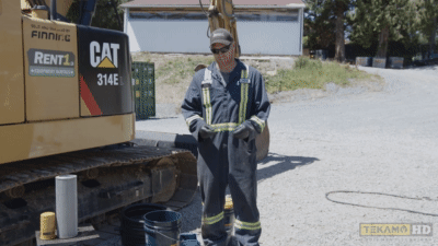 Heavy mechanic demonstrates how to put on safety glasses