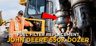 Image with text overlay saying "Fuel Filter Replacement John Deere 650K Dozer"