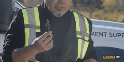 HD Mechanic is adding heat to the spade connector with a little butane torch