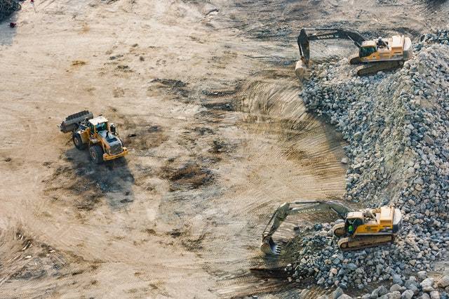 Excavators and backhoe loader on a construction site